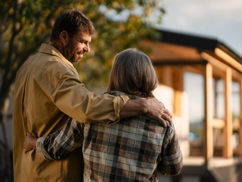 Couple looking toward a house they are planning for their future